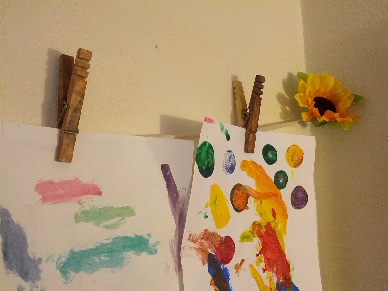 Kevin's Quality Clothespins holding up Kids Art 