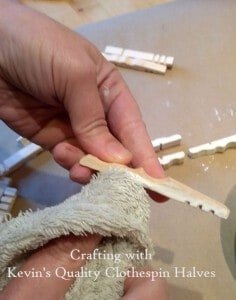 Painting clothespin halves for snowflake craft