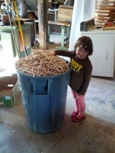 Little one with Bucket of clothes pin halves